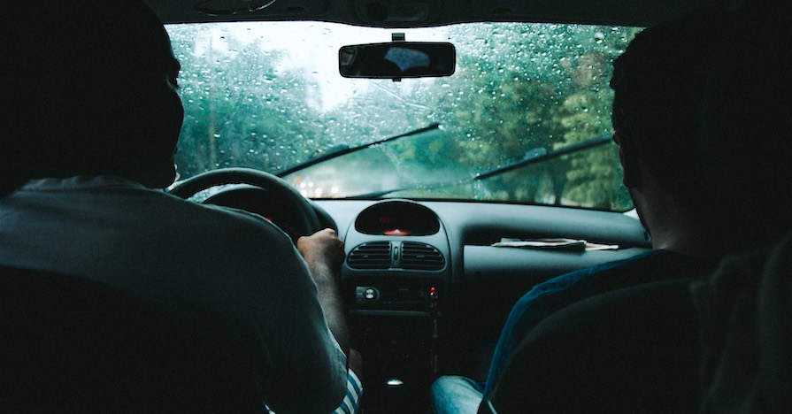 A car's windshield in the rain. Changing your car's windshield wipers every six to 12 months is a good maintenance schedule to follow and will help the components keep your windshield clean.