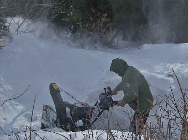 Man using snowblower